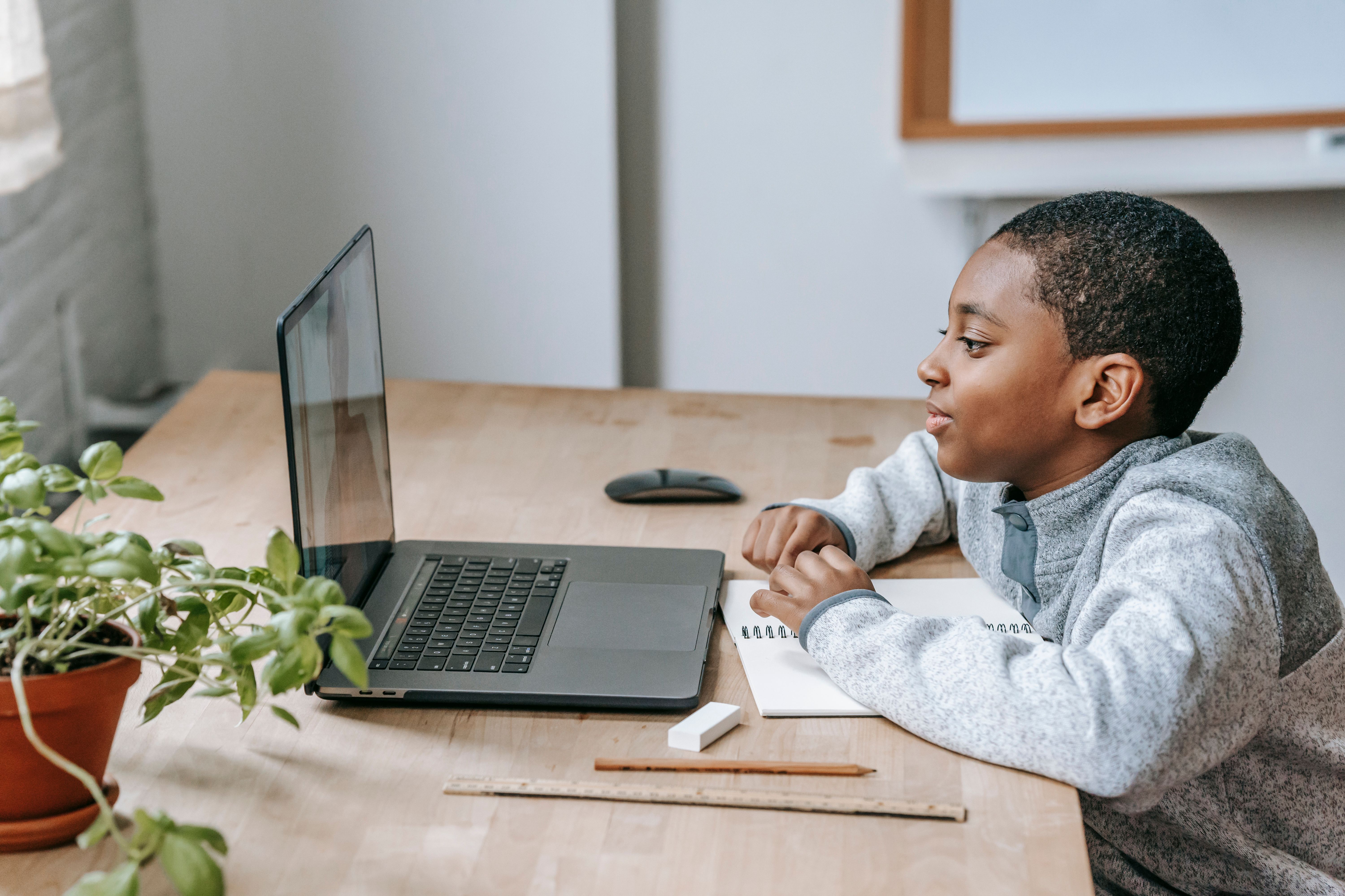 A child engaged in their studies